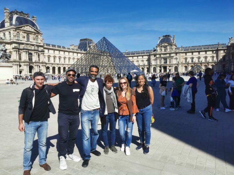 Louvre Pyramid with walkers